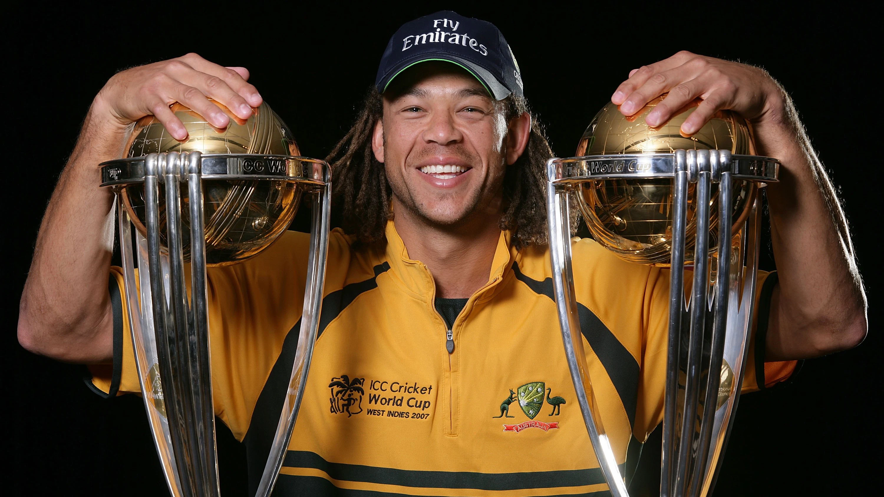 SYDNEY, AUSTRALIA – FEBRUARY 27: Andrew Symonds of Australia poses with the 1999 and 2003 World Cup trophies during the Australian Cricket team World Cup portrait session at The Hilton Hotel February 27, 2007 in Sydney, Australia. (Photo by Mark Nolan/Getty Images)
