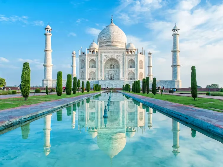 Taj Mahal and its reflecting pool beneath a clear blue sky