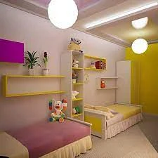 Colorful children’s bedroom with two beds and wall shelves.
