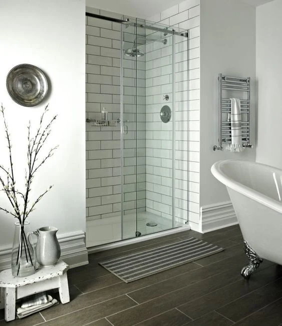 Glass shower cubicle enclosure in a bathroom.