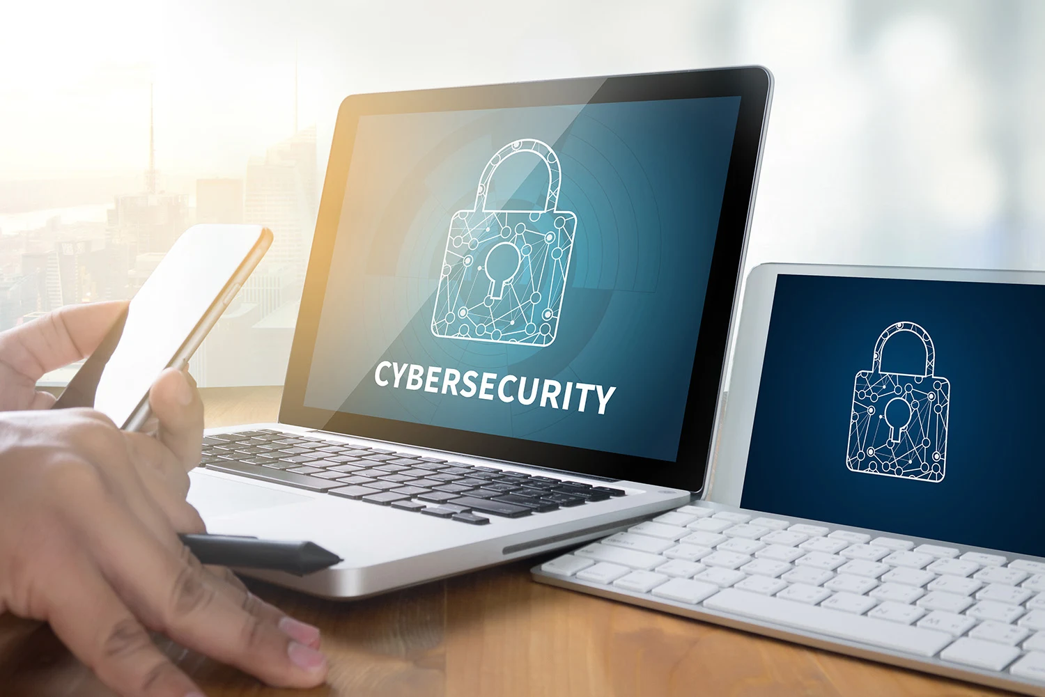 Laptop and tablet screens displaying digital padlocks for cybersecurity
