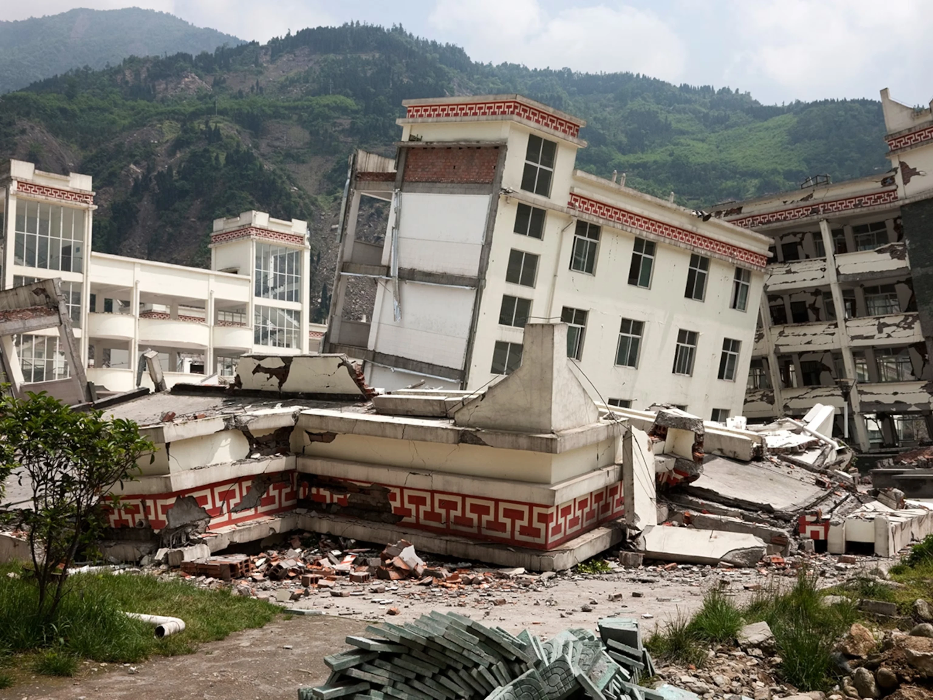 Severely damaged building in a mountain community
