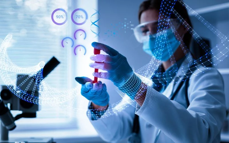 Laboratory professional examining a sample beside a microscope and digital data