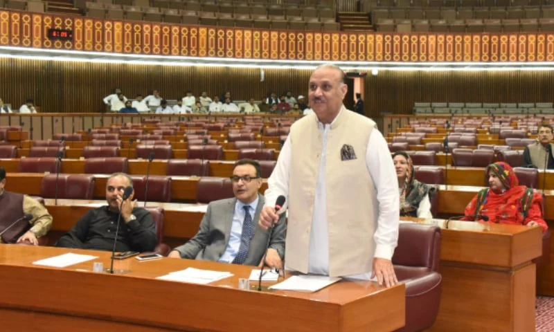 Man speaking in a legislative chamber