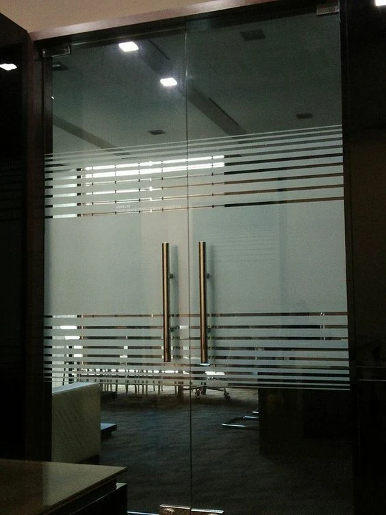 Sliding glass doors in an office partition.
